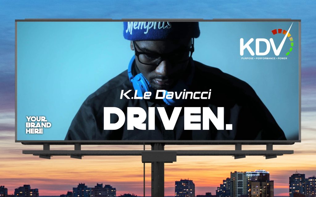 Branded KDV ENT 901 billboard featuring sponsor ad in a high-traffic urban area